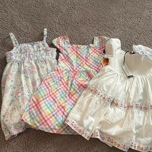 Girls 4 t dresses. All brand new. One without tags.